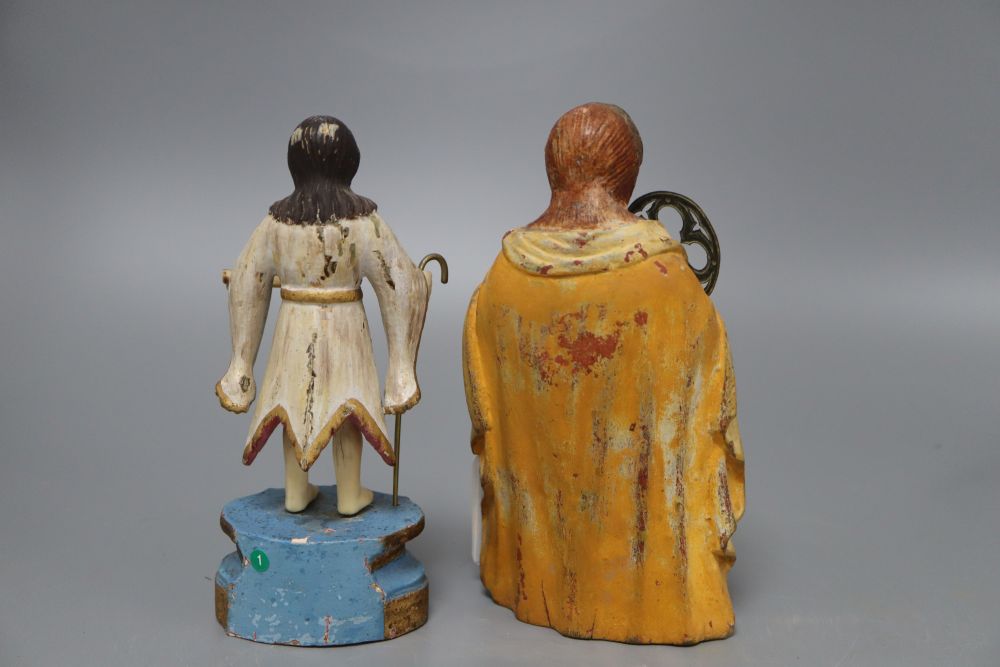 A painted carved wood religious figure of a kneeling saint and a similar painted carved wood and ivory figure, tallest 19cm